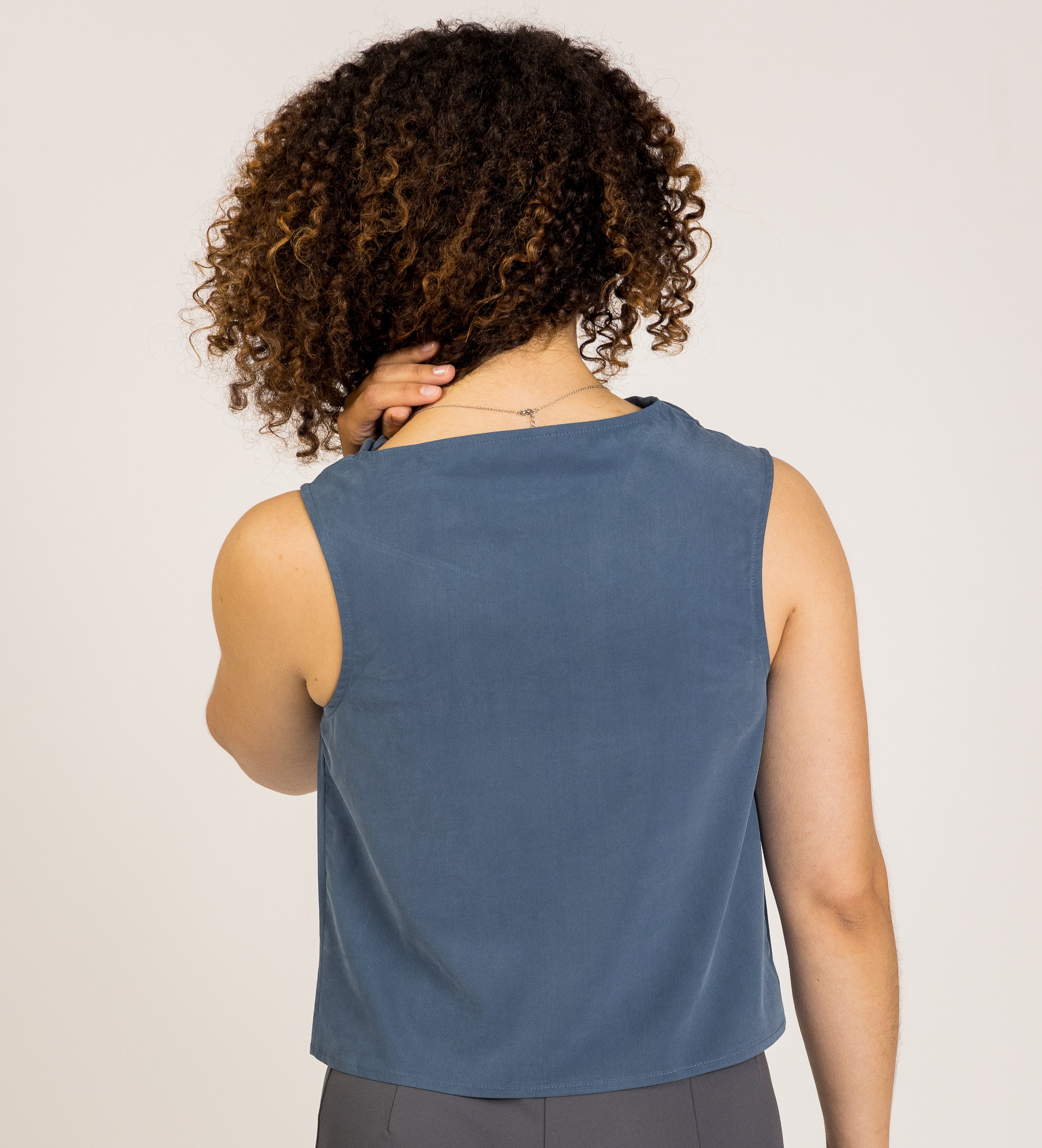 Jade Asymmetrical Cowl Top by SISU, a sophisticated sleeveless top with a soft cowl neck, suitable for professional outfits and women's corporate wear.