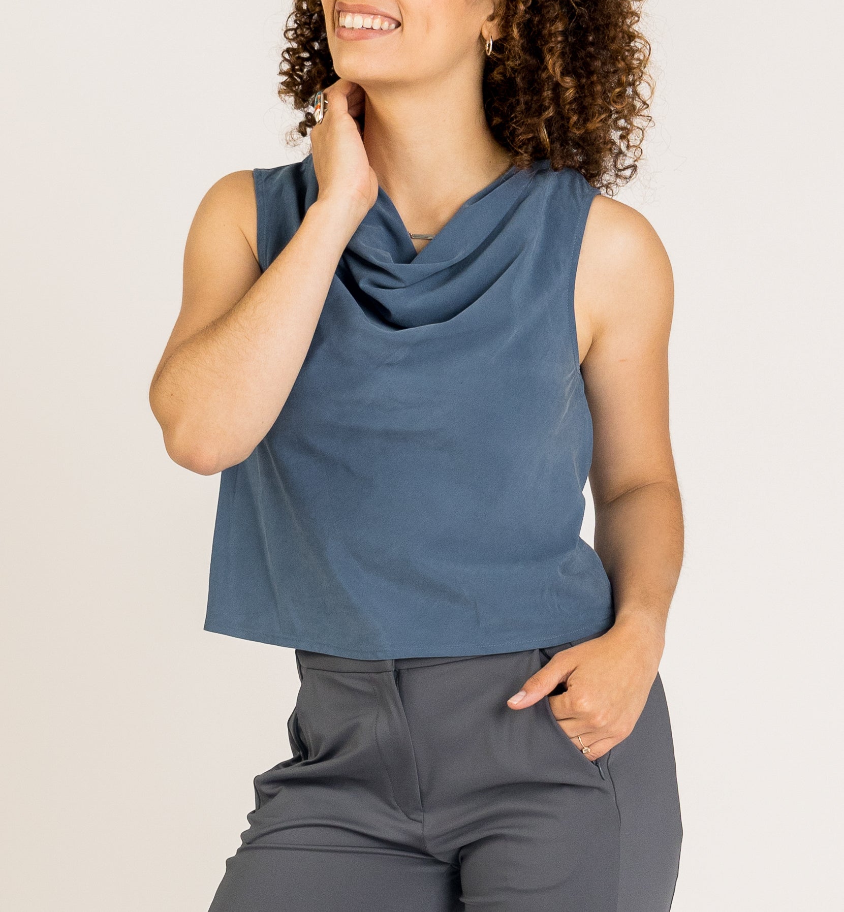 SISU Jade Asymmetrical Cowl Top is a sleeveless workwear top for women. Features a stylish draped neckline, perfect for business casual clothes for women and professional outfits