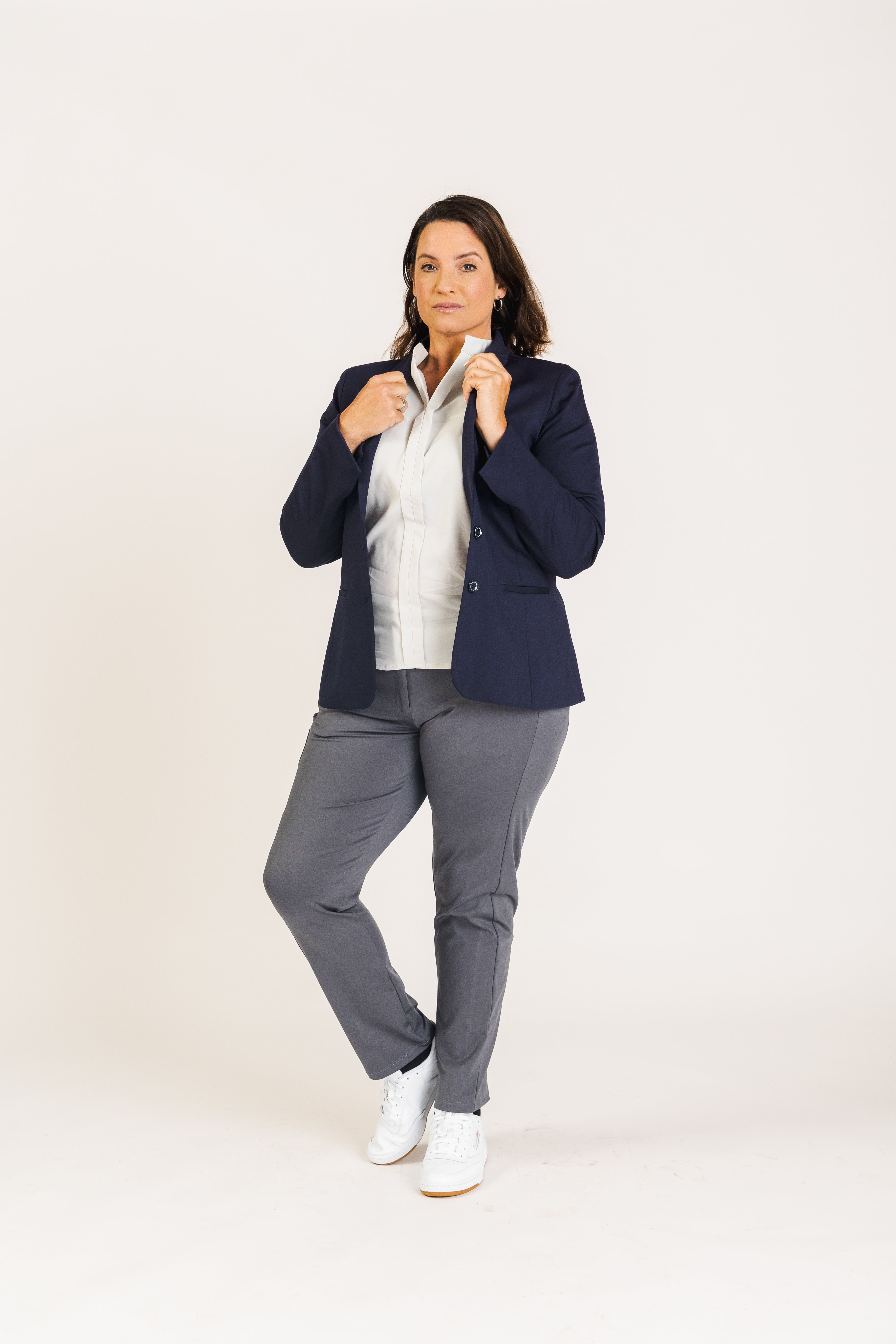 Designed for the modern woman, the Destiny Blazer blends style and function with innovative stretch fabric and three functional pockets. Perfect for work wear, its adjustable cuffs transition from full to three-quarter sleeves, making it versatile for various corporate wear needs