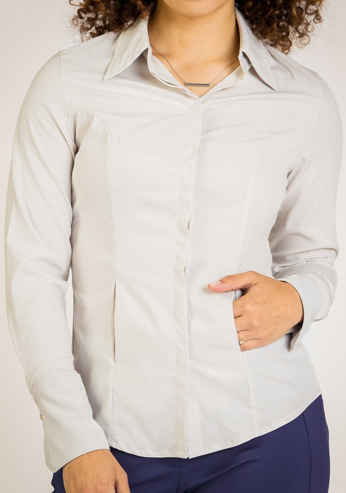 Jacquline Button-Up by SISU, a versatile, business casual shirt for women in a soft flexible fabrics and functional pockets. Designed with a relaxed yet polished fit, it’s perfect for layering in business outfits for women or professional settings. A stylish choice for women’s corporate wear.