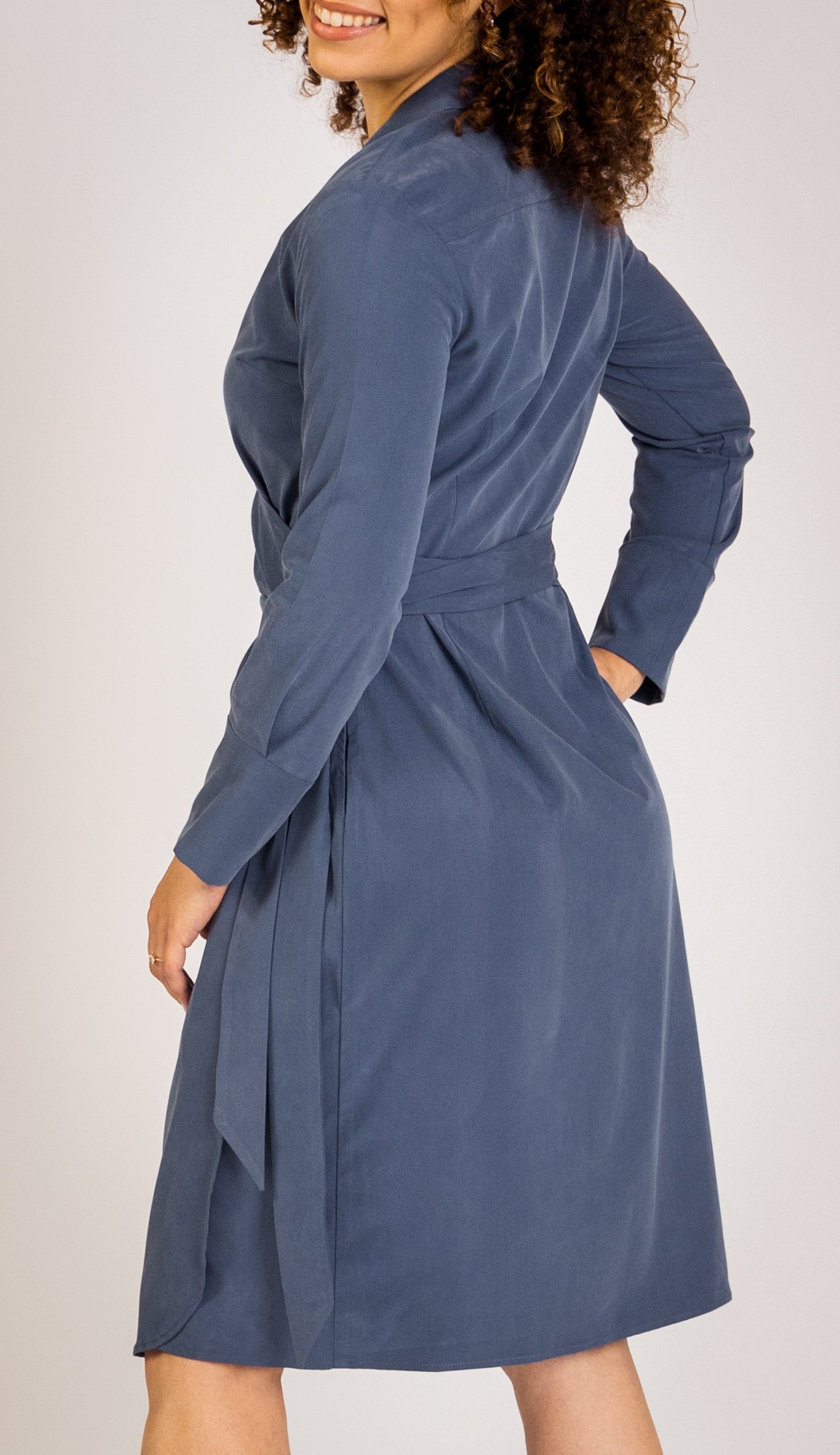 The Trinity Wrap Dress redefines work wear for women, featuring a midi-length, shape-enhancing tailoring, and practical pockets. Perfect for business casual attire, this dress radiates confidence and comfort, ideal for any corporate environment.