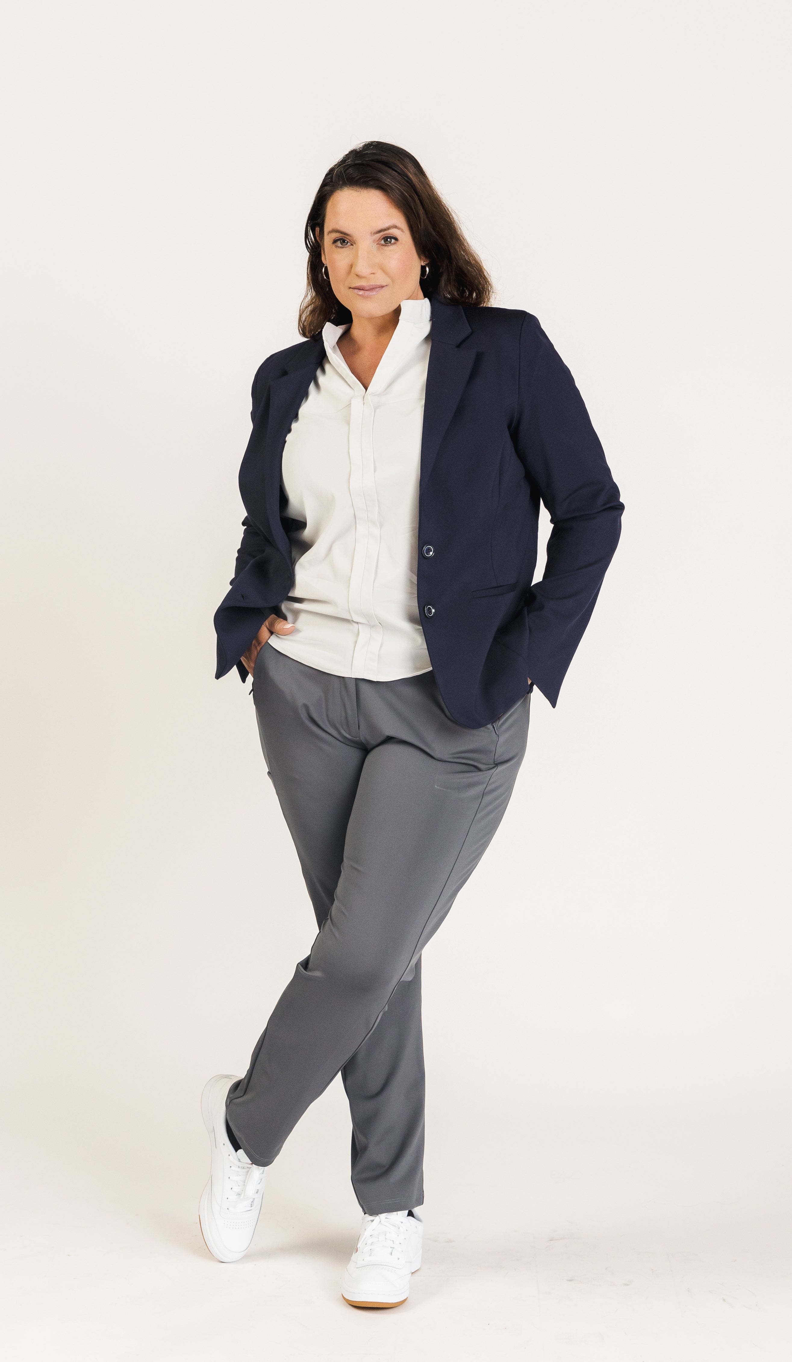 Designed for versatility, the Tenacity Pants boast a mid-rise waist and concealed contour waistband, delivering a comfortable, form-fitting silhouette. These dress pants for women offer recoverable stretch, ensuring a perfect fit across body types and a tailored straight-leg cut suitable for business casual attire