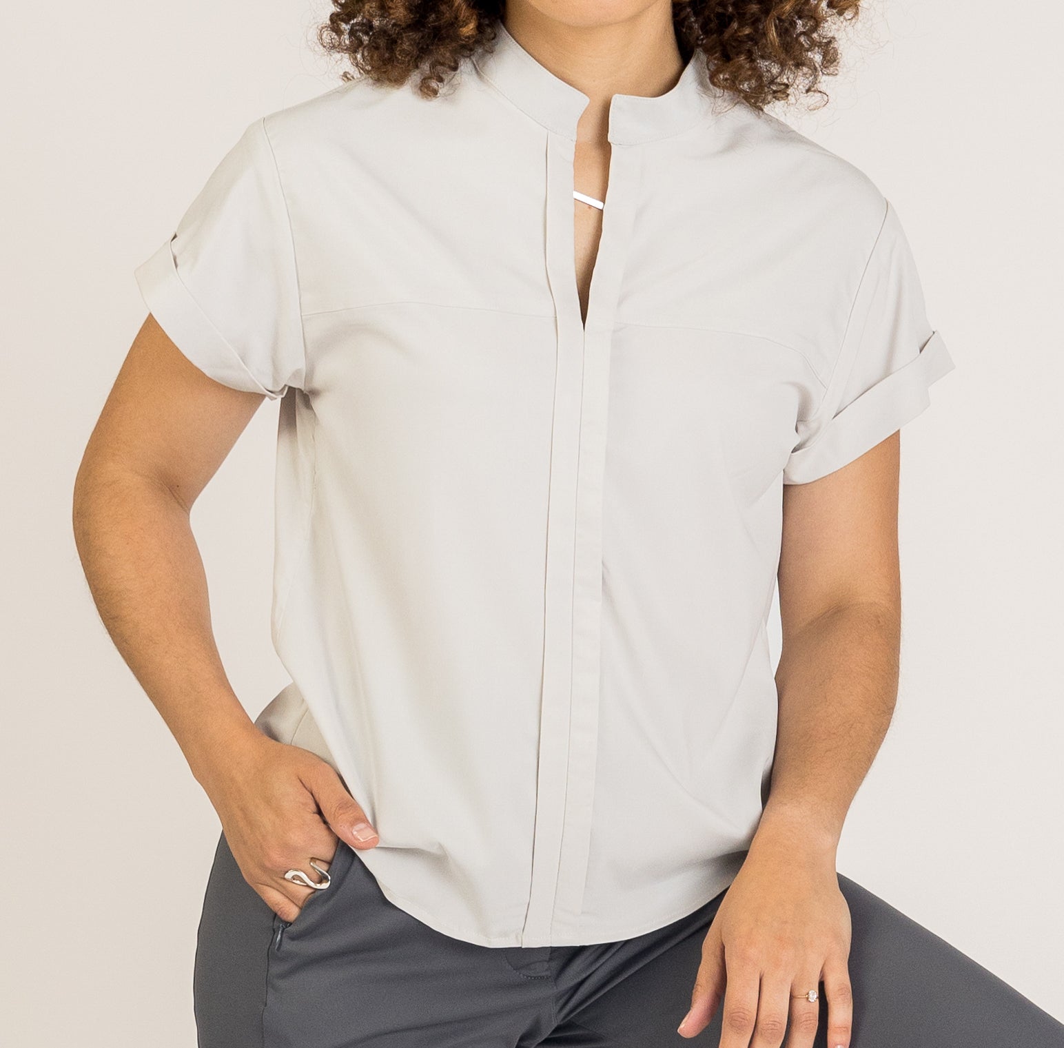 The Virgo V-Neck Top brings modern elegance to professional outfits. Featuring a breathable, stretch poplin and a tailored feminine silhouette, this top transitions effortlessly from work wear to business casual, supporting comfort without compromising style