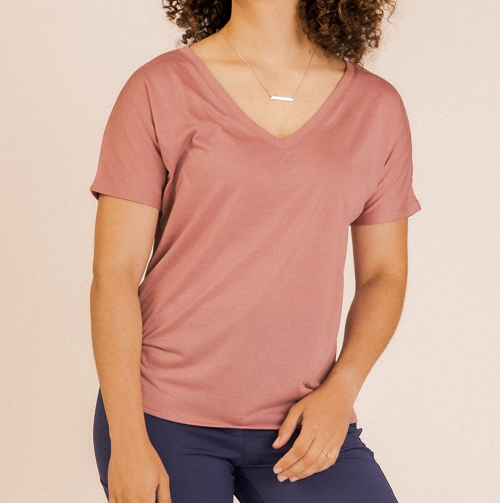 Journey V-Neck top with a flattering V-neckline and short sleeves, designed for work wear women prefer. A versatile piece that pairs effortlessly with both business casual and professional outfits.